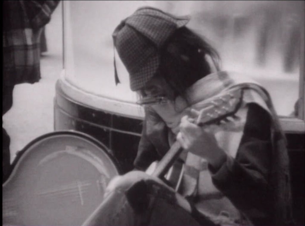 Watch Neil Young Busking In Glasgow